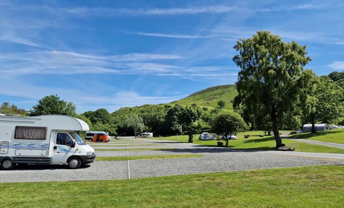 hard standing pitches with EHU with views of mountain